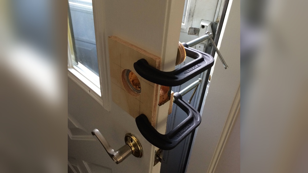 How to Enlarge a Deadbolt Hole in a Metal Door
