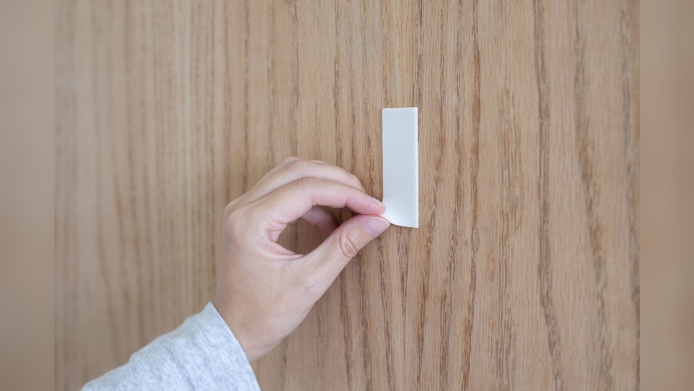 How to Get Mounting Tape off Wood